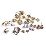 Various gold earrings, including knot design, pear