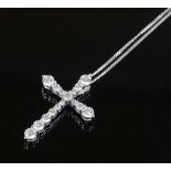 A 9ct white gold diamond set cross pendant, on 9ct