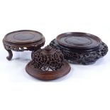 2 Chinese carved and pierced hardwood stands, and