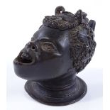 A patinated bronze Classical head design inkwell,