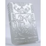 A Chinese relief carved white jade pendant with te