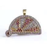 An 18ct gold and platinum ruby and diamond set sun