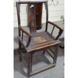An Antique Chinese stained elm elbow chair, with c