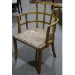 A 1930s Art Deco walnut lattice-back armchair in t