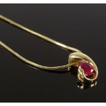 An 18ct gold ruby pendant, on 9ct chain, pendant h