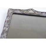 An Art Nouveau silver-fronted mirror, with embosse