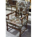 A 19th century Italian carved oak-framed armchair,