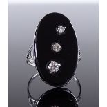 An Art Deco silver onyx and diamond set panel ring