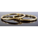 A pair of Tiffany & Co. 18ct gold bangles, interna