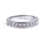 A platinum diamond half eternity ring, set with Pr