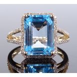 A 14ct gold blue topaz and diamond cluster ring, e