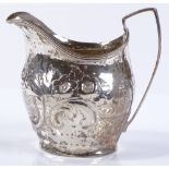A George III silver cream jug, with relief embosse