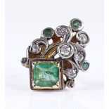 An 18ct gold emerald and diamond cluster cocktail