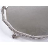 A circular silver waiter / salver, with gadrooned