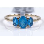 A 9ct gold neon apatite 3-stone dress ring, settin