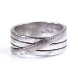 An 18ct white gold crossover-band ring, in the sty