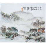 A Chinese porcelain plaque depicting a mountain la