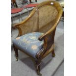 An early 19th century mahogany-framed Bergere tub