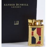 A lady's gold plated Dunhill lighter with red and