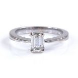 A platinum solitaire diamond ring, emerald-cut dia