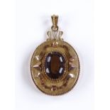 An Austrian 14ct gold smokey quartz pendant, with