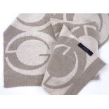 Gucci Italy, a fine wool knitted scarf in beige /