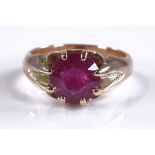 A 9ct gold ruby gypsy ring, setting height 10.1mm,
