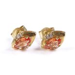 A pair of 9ct gold fire opal and white topaz stud