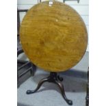 A circular mahogany occasional table on tripod bas