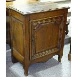 A 19th century French panelled oak side cupboard,