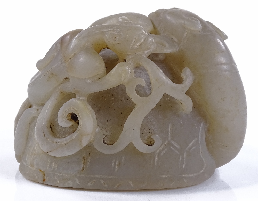 A Chinese carved and pierced jade dragon ornament, - Image 2 of 3