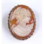 A relief carved cameo brooch / pendant, depicting