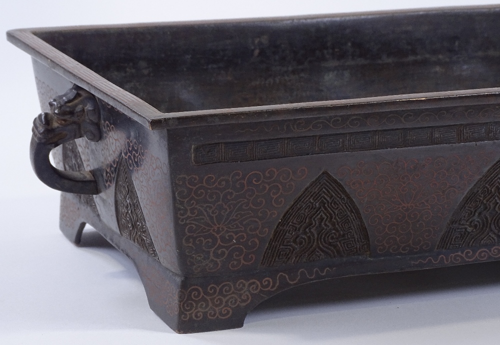 A Chinese rectangular bronze planter, relief mould