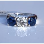 An 18ct white gold 3-stone sapphire and diamond ri