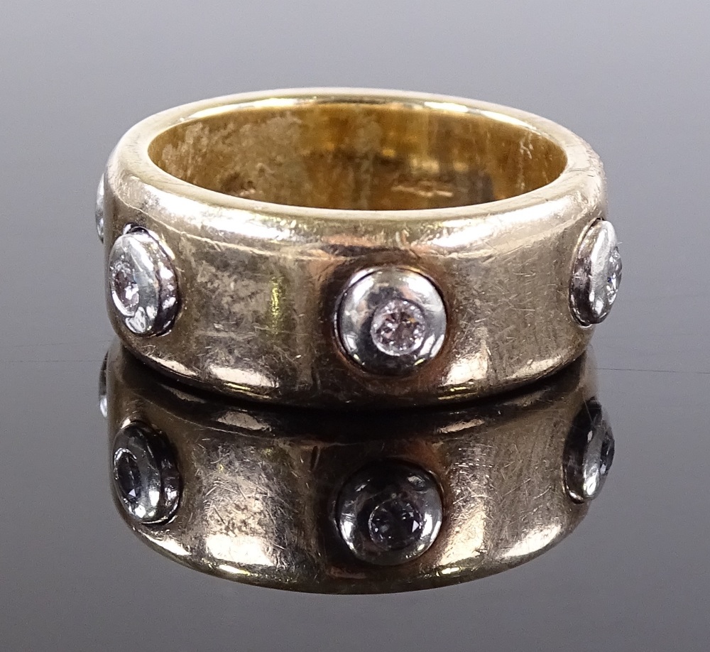 A 9ct gold diamond set band ring, diamond content