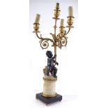 A 19th century French bronze candelabra, supported