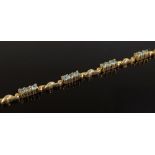 A 9ct gold alexandrite line bracelet, length 200mm