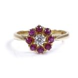 An 18ct gold ruby and diamond cluster flowerhead r