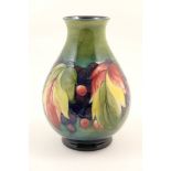 Moorcroft Leaf and Berries vase, baluster form with slightly flared neck,