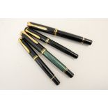 Four Pelikan fountain pens comprising Souveran M800 in black and green with 18ct two colour gold