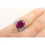 Ruby and diamond cluster ring, the oval ruby approx.