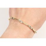 18ct two colour gold and diamond bracelet, having guilloche links,