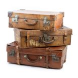 Three vintage leather suitcases,