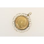 Edward VII half sovereign pendant, the coin of 1906, in a 9ct gold wirework pendant mount,