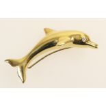 18ct gold and diamond leaping dolphin brooch, polished form, the dolphin with a diamond set eye,