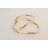 Cultured pearl, coral and gold barrel linked choker necklace, the pearls of uniform size,