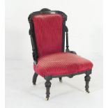 Victorian Aesthetic period ebonised and upholstered nursing chair, circa 1875,