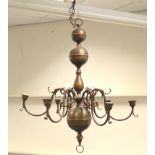 Dutch style brass chandelier, with a central ball and baluster column,