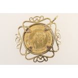 Queen Elizabeth II sovereign, 1980, within a 9ct gold open wirework pendant mount,