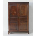 Edwardian mahogany wardrobe, having a cavetto moulded cornice over two triple fielded panel doors,